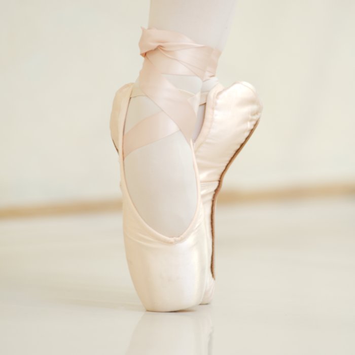 Foto Fuß in Ballettschuh bei Spitzentanz